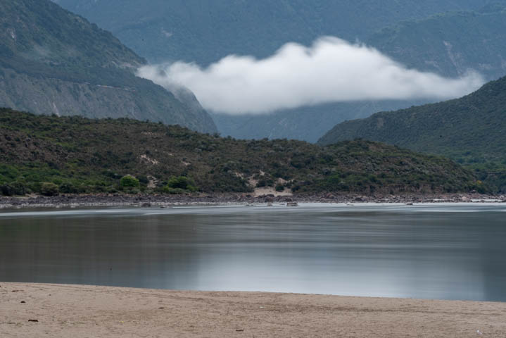 a lone cloud float above the lake