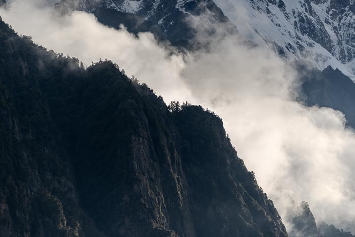 cloud and fog divided the snow mountain